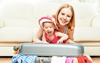 mom and baby packing luggage