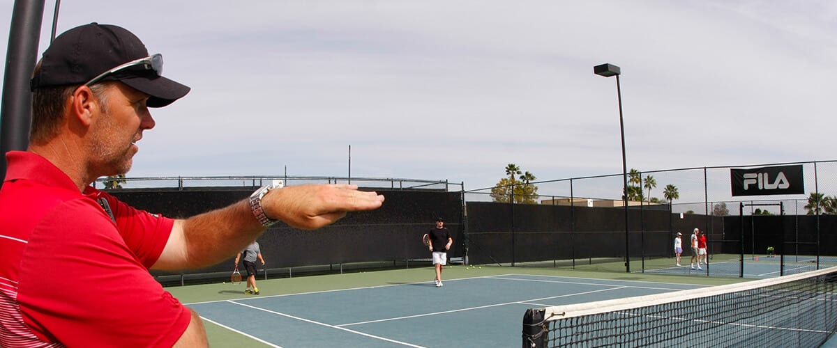 coach talking to tennis players