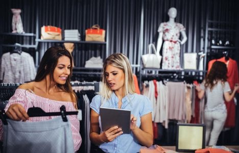 Two ladies shopping for skirts